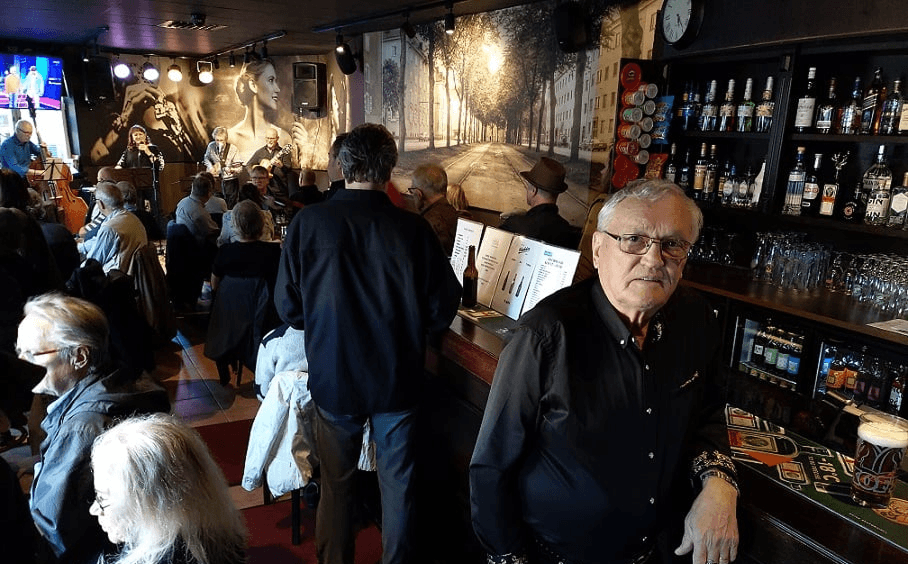 Crowd and bar interior during jazz night